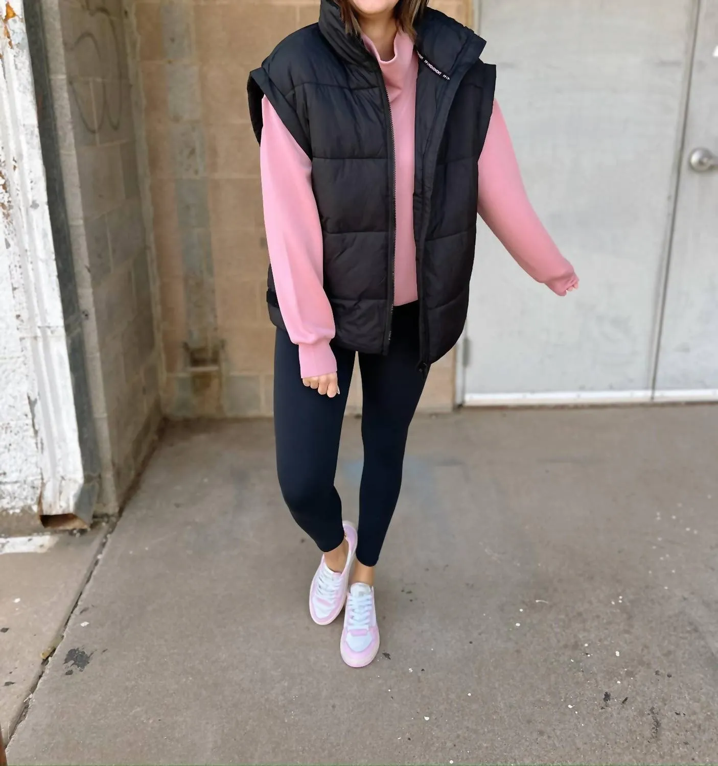 In A Bubble Puffer Vest In Black